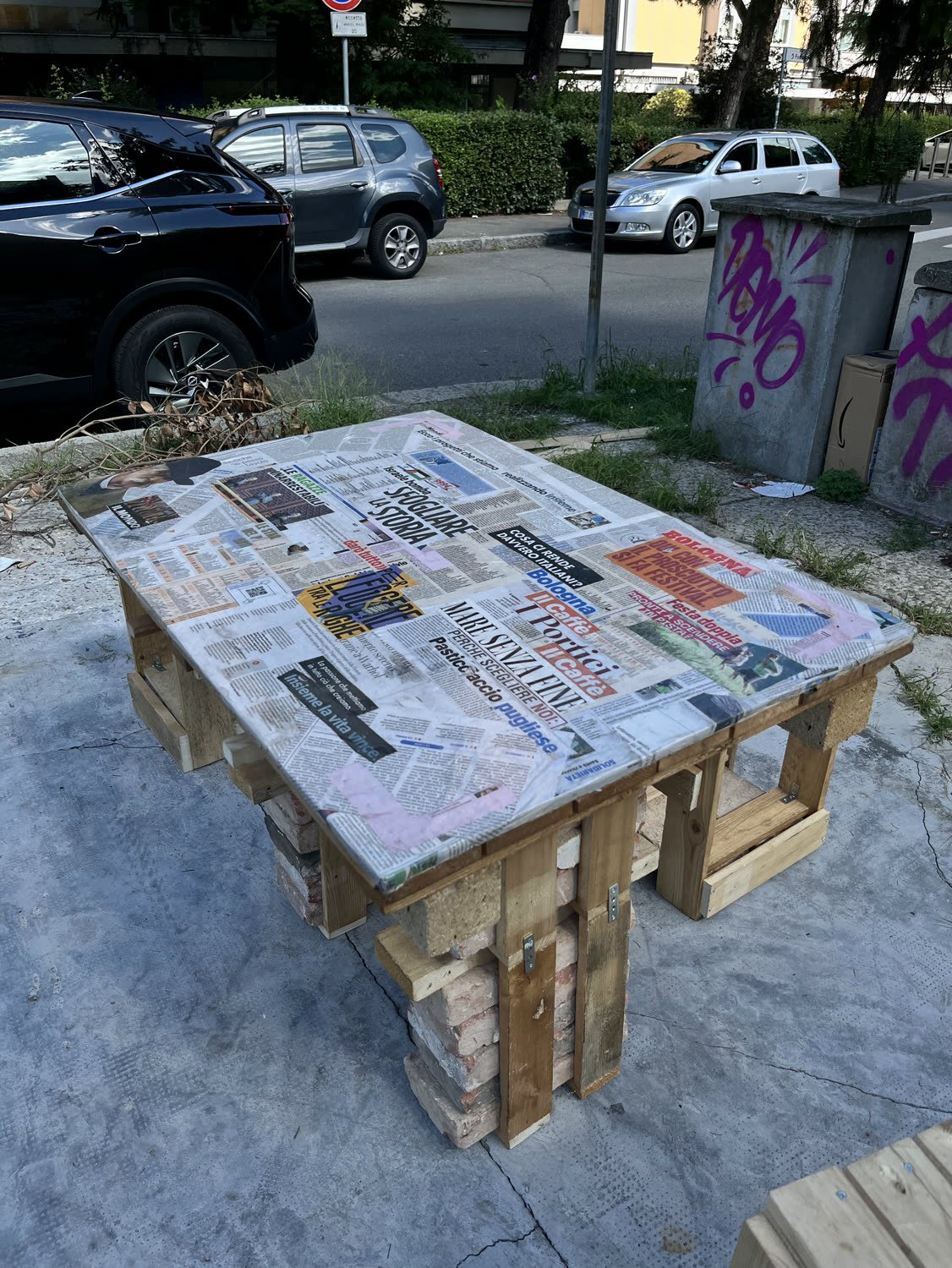 The full set, table and stools, with the street behind