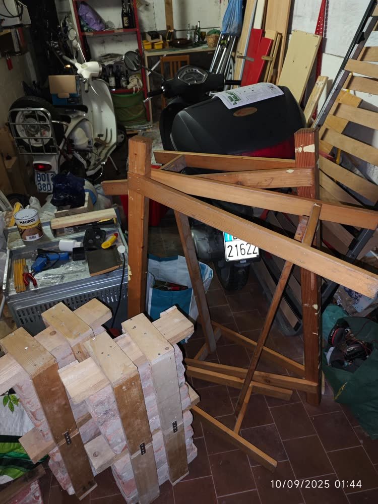 Stool parts stacked beside the sawhorse