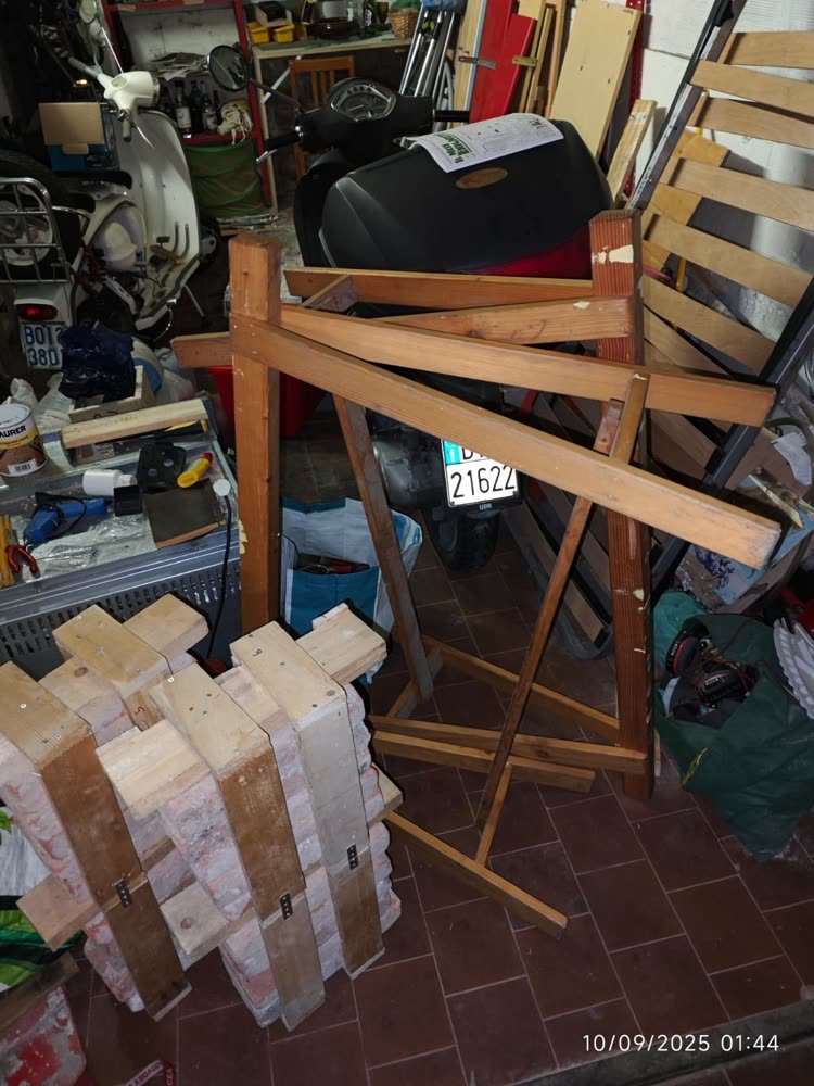 The garage workshop: sawhorse, offcuts, stacked blocks