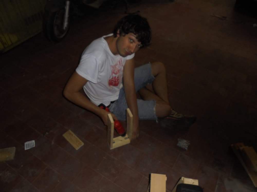 Screwing a stool frame together on the floor