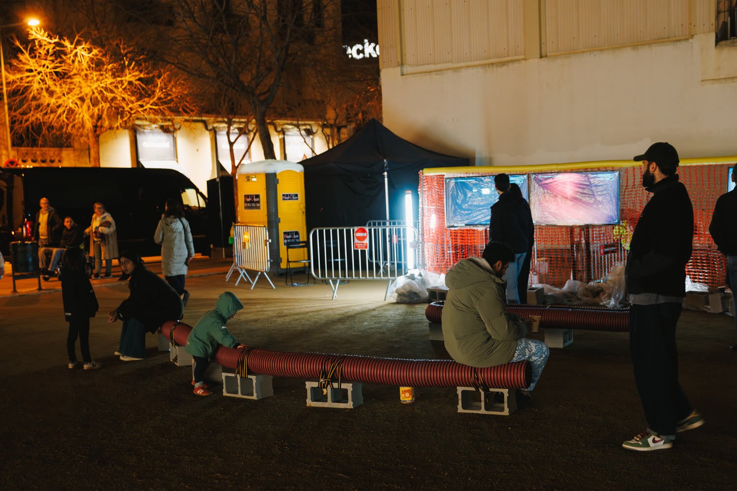 The excavation site at night, barriers, smoke and the light bar