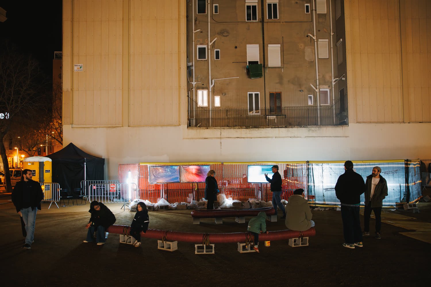 The excavation site at night, barriers, smoke and the light bar