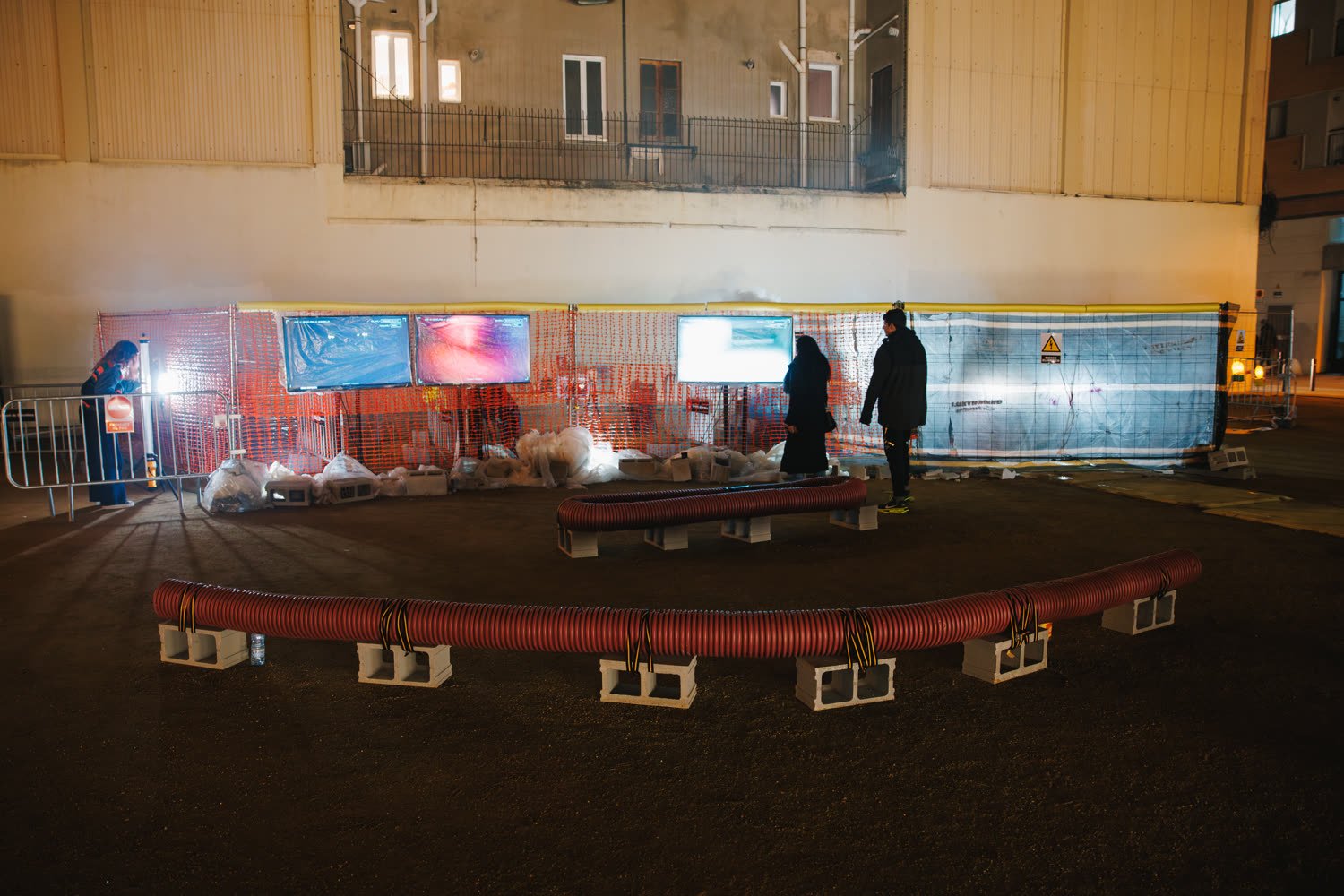 The excavation site at night, barriers, smoke and the light bar