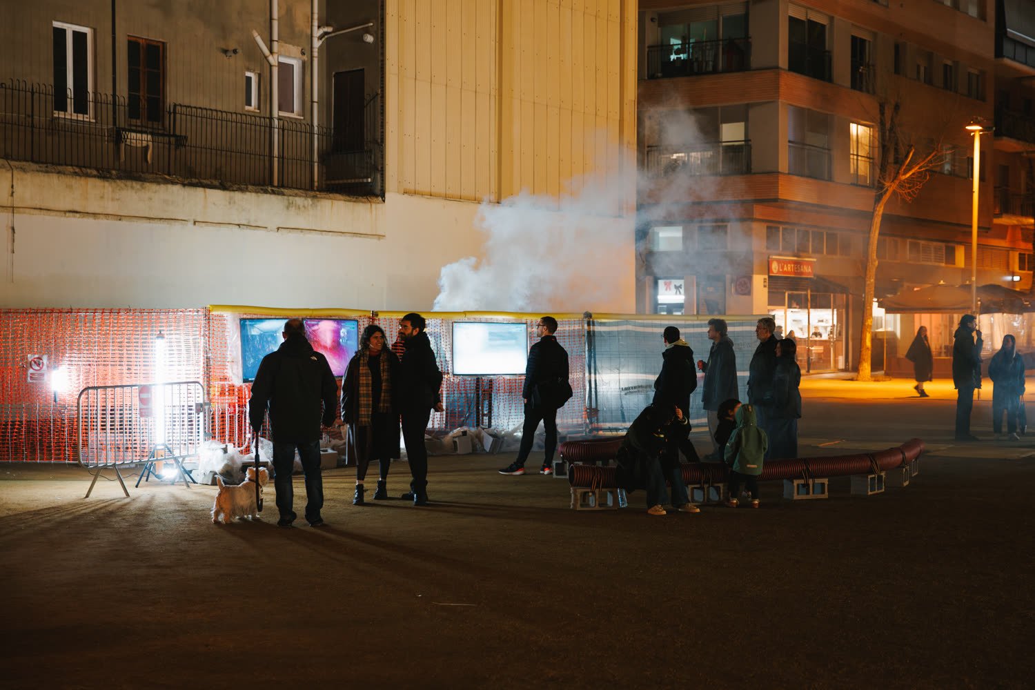The excavation site at night, barriers, smoke and the light bar