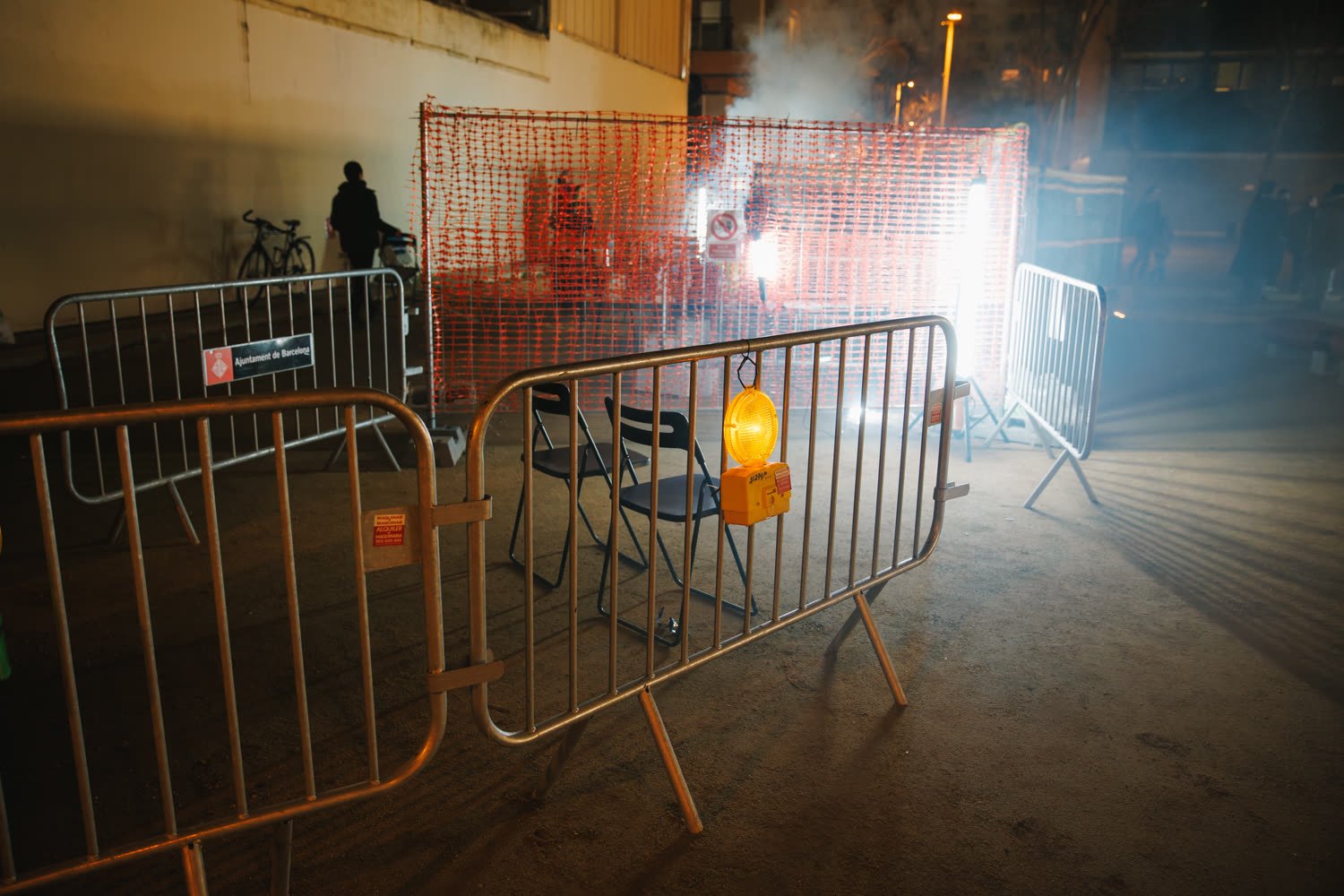 The excavation site at night, barriers, smoke and the light bar