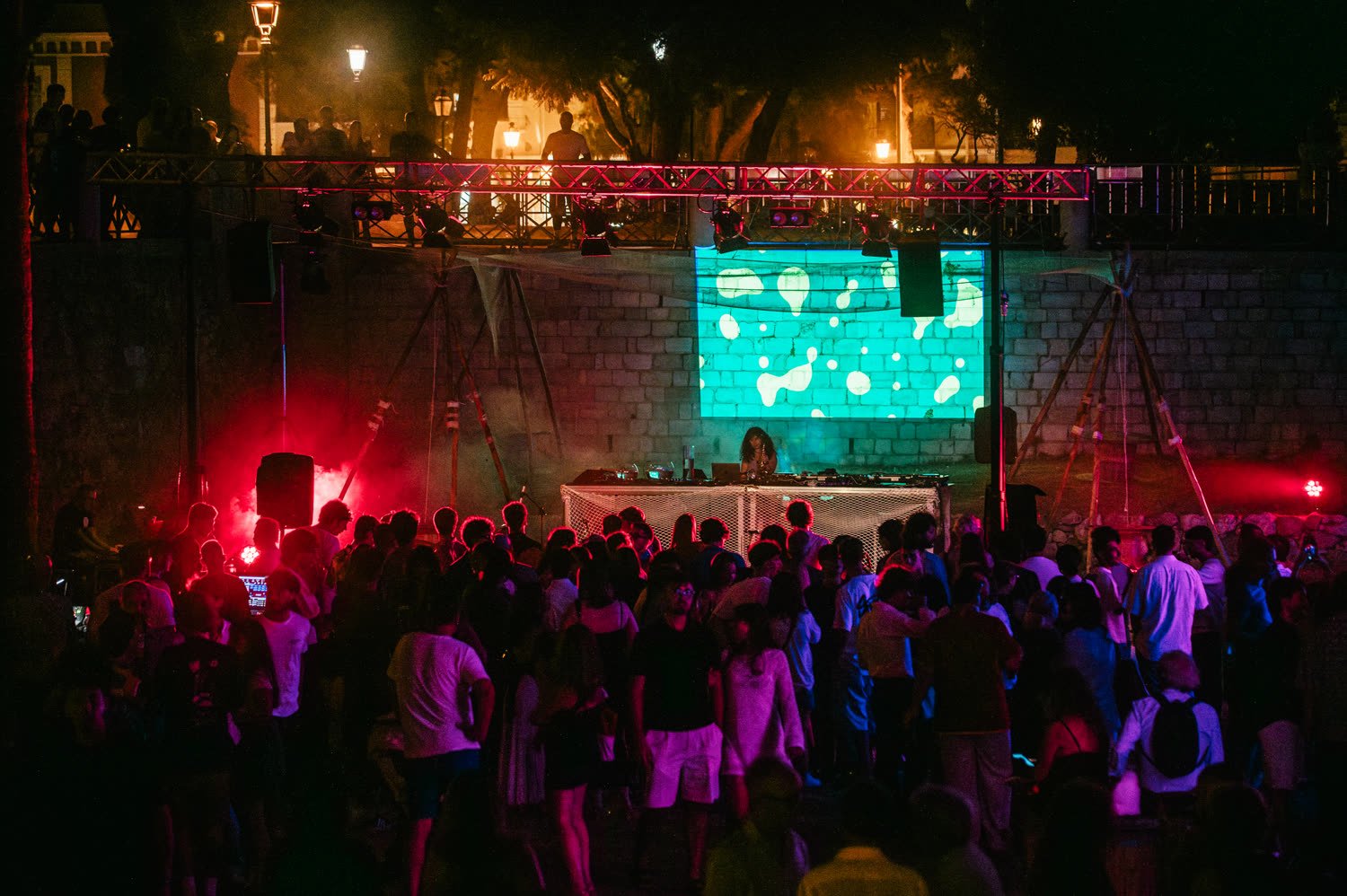 Projection on the wall above the crowd