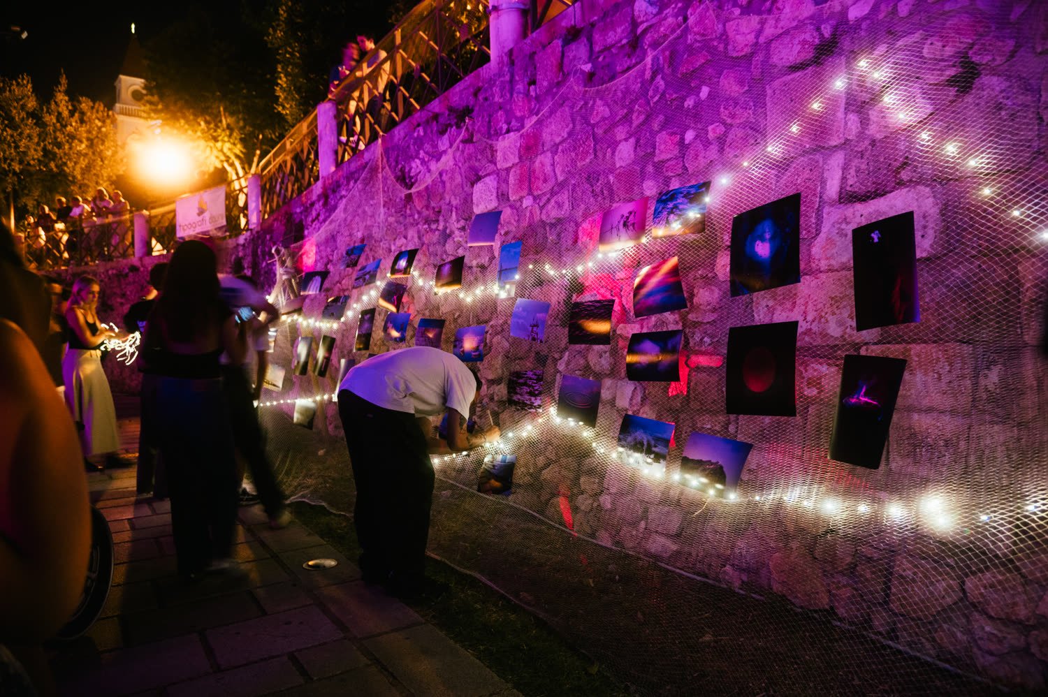 Strings of lights along the old wall