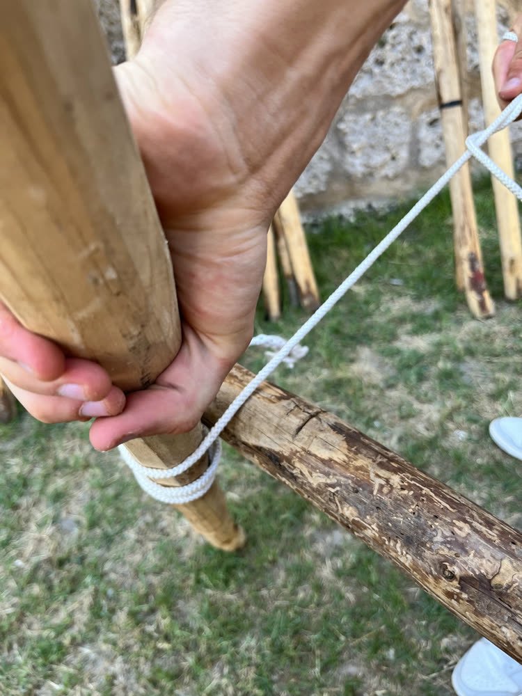 Hands finishing a lashing