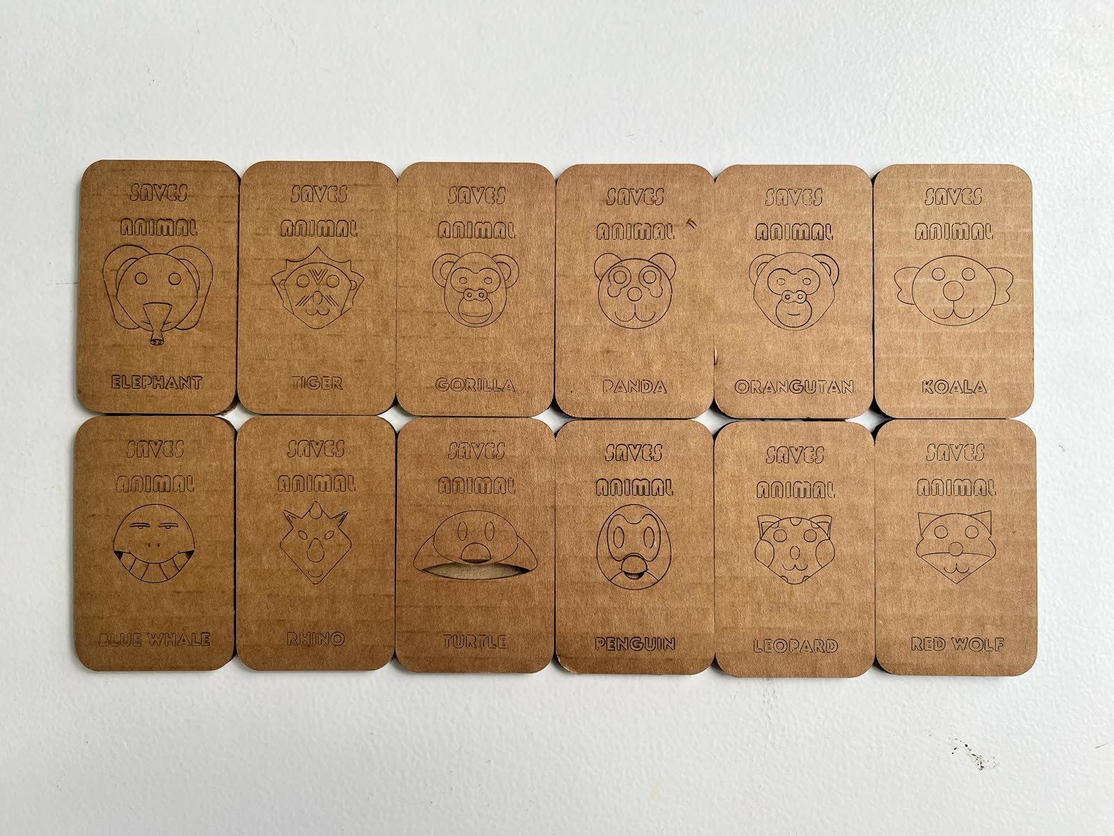 The SAVES ANIMAL board game and its pieces